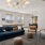a lounge with a large couch and chairs