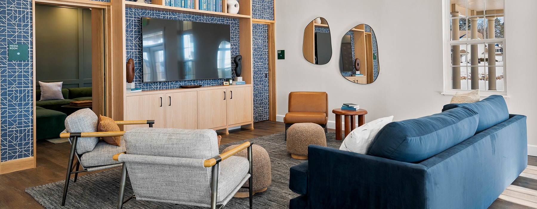 room with blue couch and entertainment center
