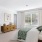 Bedroom with natural lighting and high ceilingsed