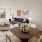 Living room with wood flooring and natural lighting